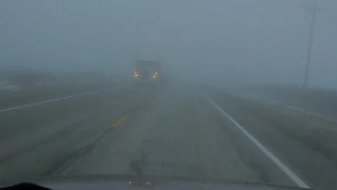Dash camera driving in fog with oncoming traffic. Stock-Footage 71659563