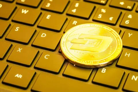 Dash coin on computer keyboard Stock Photos