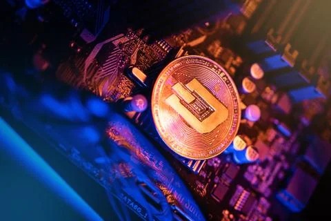 Dash Cryptocurrency coin on a PC computer motherboard, crypto currency mining Stockfoto's