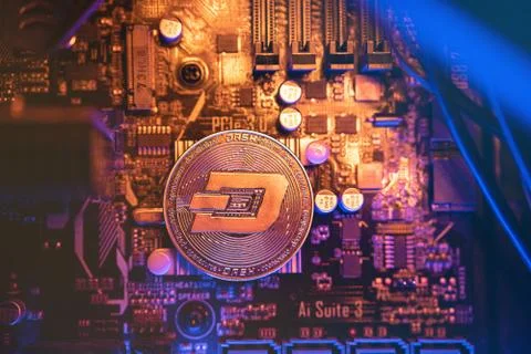 Dash Cryptocurrency coin on a PC computer motherboard, crypto currency mining Stockfoto's