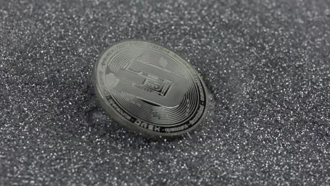 Dash cryptocurrency falls on silver sequins. Stock Footage 155544127