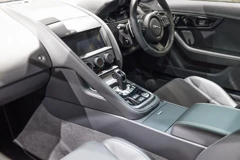 Dashboard and gear selector inside a Jaguar F-Type Coupe. London, UK, 24 Stock Photos