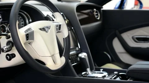Dashboard and wheel, gear(shift) lever - logo - Bentley (interior) Stock Footage 42419935