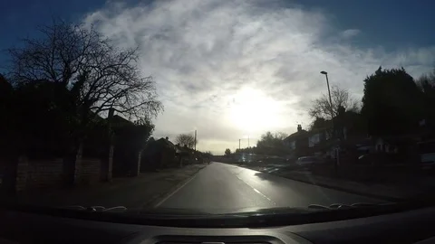 Dashboard camera view of car driving along a residential street Stock Footage 83423341