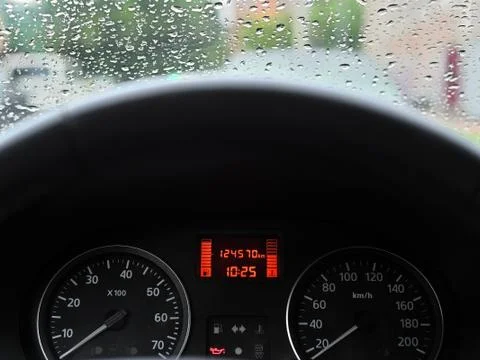 On the dashboard of the car the indicator lights up in the form of a red oil can Stock Photos