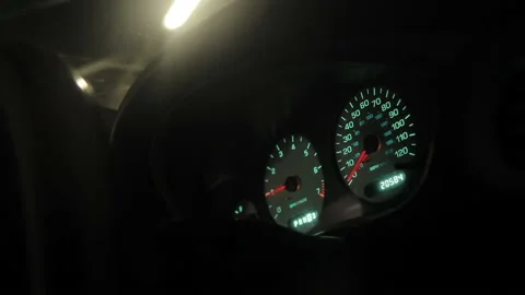 Dashboard in the car. Speedometer and moving,featuring lights leaks. Close up Video stock 118161572