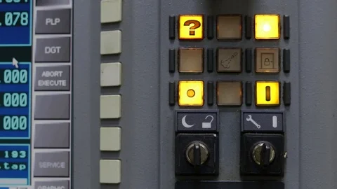 The dashboard of the CNC system. A button with a question mark flashes. Stock Footage 125156115