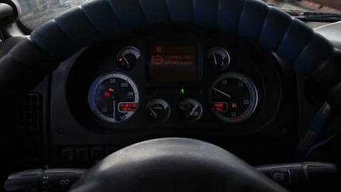 Dashboard of heavy vehicle interior, driver perspective. Steering wheel Stock Footage 325298838