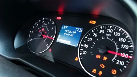 Dashboard of modern low-cost budget car with analog arrows. Speedometer and Stock Footage 298705961