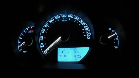 Dashboard with moving arrows of tachometer and speedometer, digital display of Stock Footage 276365490