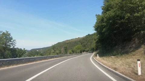 Dashboard point of view POV, driving on Slovenia curved countryside road Stock Footage 130075102