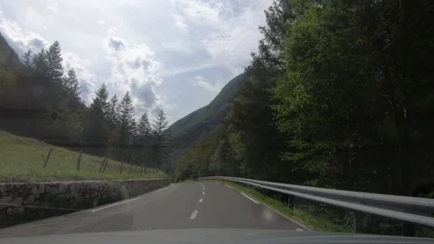Dashboard point of view POV driving on curved countryside paved road Stock Footage 138590790