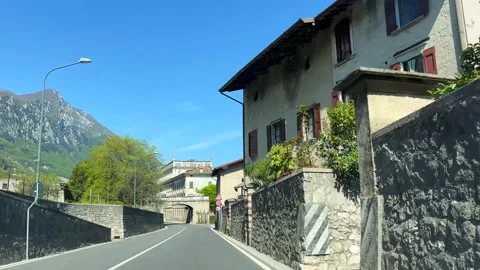 Dashboard POV Driving through Italian Village Mountains Sunny Fast 4k Stock Footage 192959657