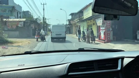 Dashboard View Driving Along Local Village Street in Cirebon Stock Footage 346438863