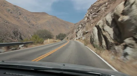 Dashboard view-driving winding two-lane canyon road in Kern Canyon, California Stock Footage 40626185