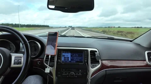Dashboard View on a Multi-lane Highway Through Open Fields with Cars and Stock-Footage 347681597