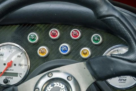 Dashboards in a car with different level and speed indicators Stock Photos