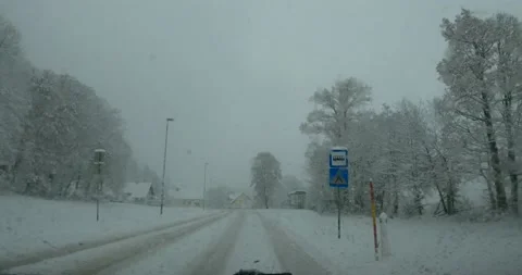 Dashcam dash camera POV driving on snowy countryside forest road Stock Footage 145910786