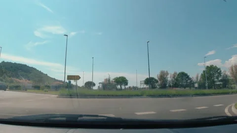 Dashcam dashboard camera view of car driving on seaside countryside road Stock Footage 156078443