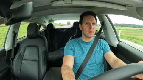 DASHCAM Driver having hands-free phone call via car calling system while driving Stock Footage 237973373