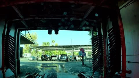 Dashcam footage of a car wash with palm trees, Los Angeles Stock Footage 344010953