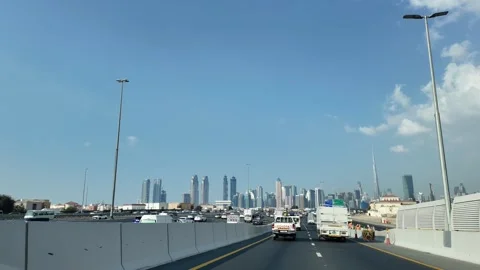 Dashcam view of Downtown Dubai and Burj Khalifa from Al Khail Road on a clear Stock Footage 301176208