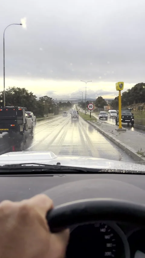 Dashcam view of highway traffic driving on a wet road during rain Stock Footage 337430170