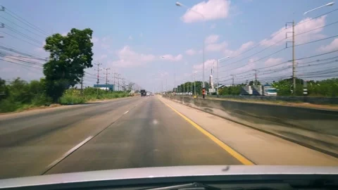 Dashcam view of a vehicle driving fast in the right lane on a highway toward Stock Footage 339802192