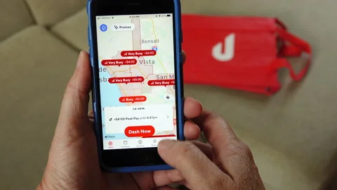 Dasher logs into Doordash driver app Stock Footage 131348986