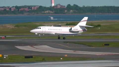A Dassault Falcon 2000 private plane lands Boston Mass. April 26 2014 Stock Footage 277117215