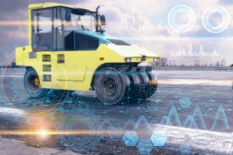 Data analysis and transmission during the construction of a road by a yellow Stock Photos