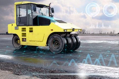Data analysis and transmission during the construction of a road by a yellow Stock Photos