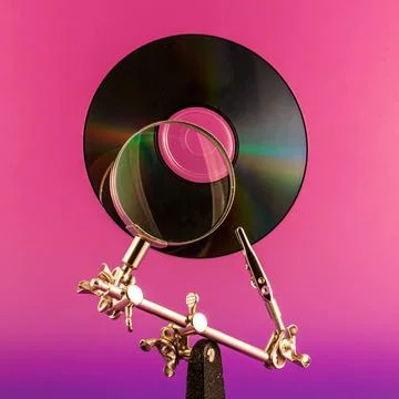 Data Analysis Concept for data analysis, CD and lens on a vivid colors bac... Stock Photos