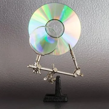 Data Analysis Concept for data analysis, CD and lens on a vivid colors bac... Stock Photos