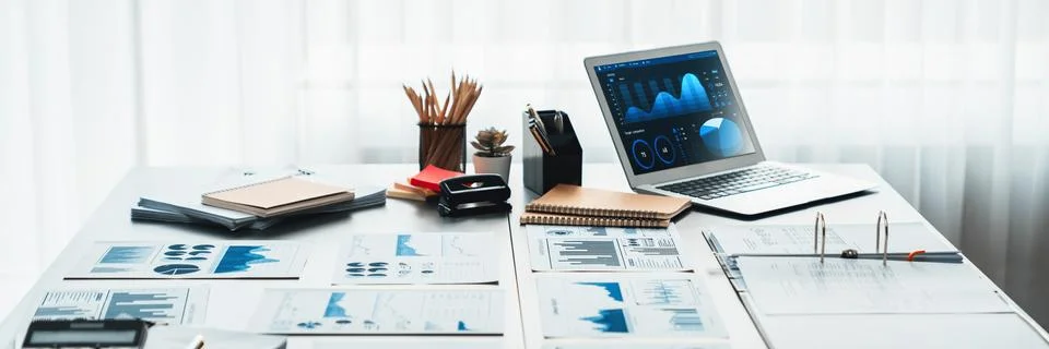 Data analysis dashboard display on laptop screen on office table. Insight Stock Photos