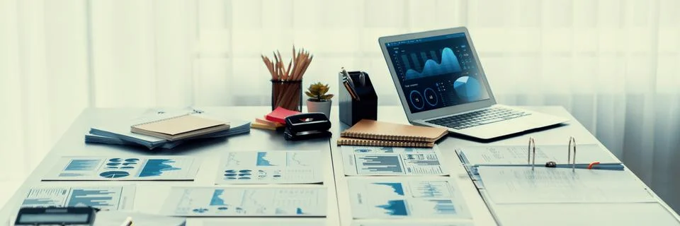 Data analysis dashboard display on laptop screen on office table. Insight Stock Photos