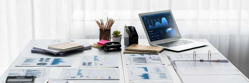 Data analysis dashboard display on laptop screen on office table. Insight Stock Photos