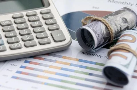 Data analysis with isolated bank notes and calculator. Business finance conce Stock Photos
