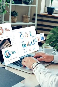 Data analysis on a laptop showing statistics for business performance in a Stock Photos
