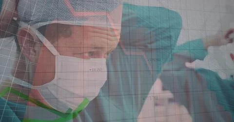 Data analysis on senior surgeon in mask highlights medical tech advancements. Stock Photos