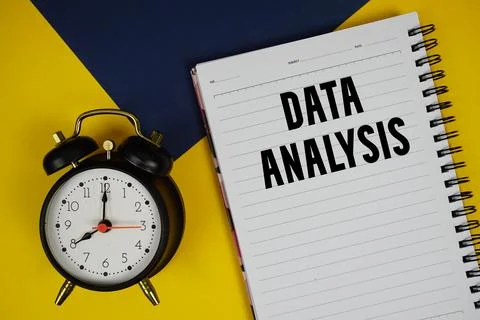 Data Analysis text written on notepad with alarm clock on yellow background Foto stock