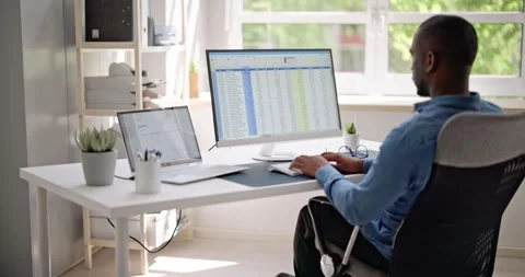 Data Analyst African Man Using Spreadsheet Stock Footage 242029655