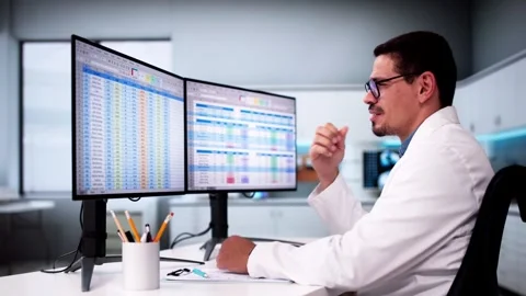 Data Analyst African Man Using Spreadsheet Stock Footage 283691308