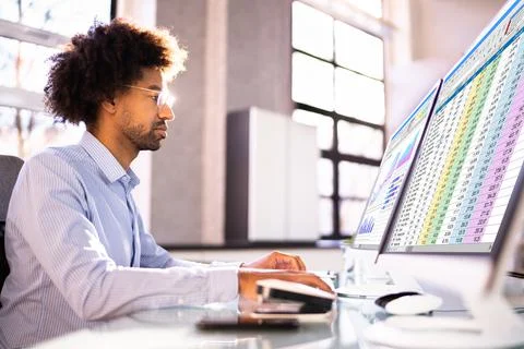 Data Analyst African Man Using Spreadsheet Stock Photos