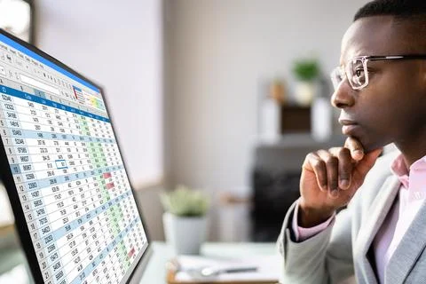 Data Analyst African Man Using Spreadsheet Stock Photos