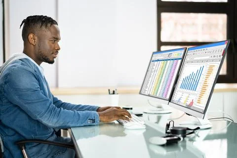 Data Analyst African Man Using Spreadsheet Stock Photos