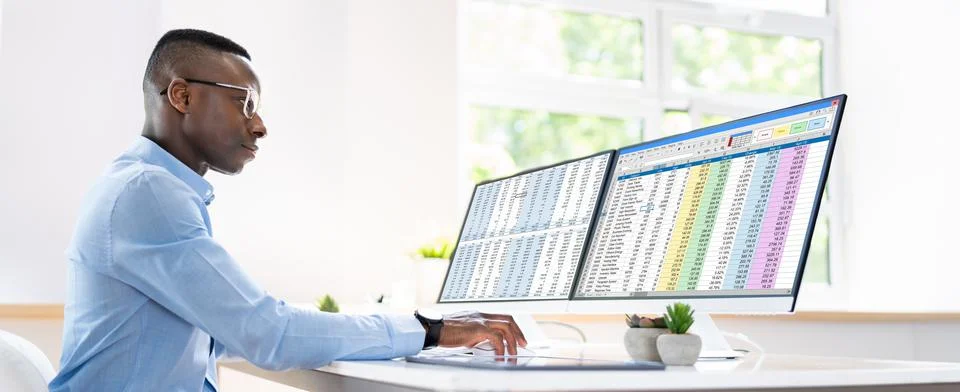 Data Analyst African Man Using Spreadsheet Stock Photos