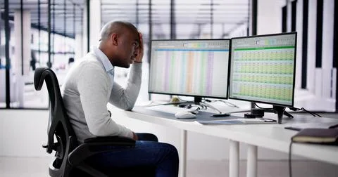 Data Analyst African Man Using Spreadsheet On Computer Stock Photos