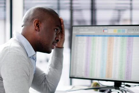 Data Analyst African Man Using Spreadsheet On Computer Stock Photos