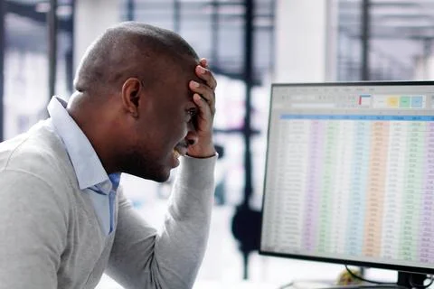 Data Analyst African Man Using Spreadsheet On Computer Stock Photos
